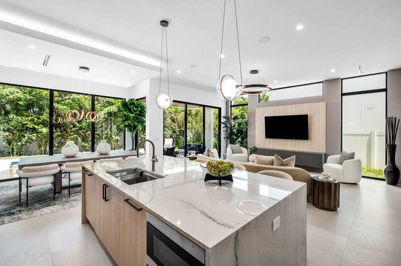 Open kitchen and living room overlooking the tropical garden