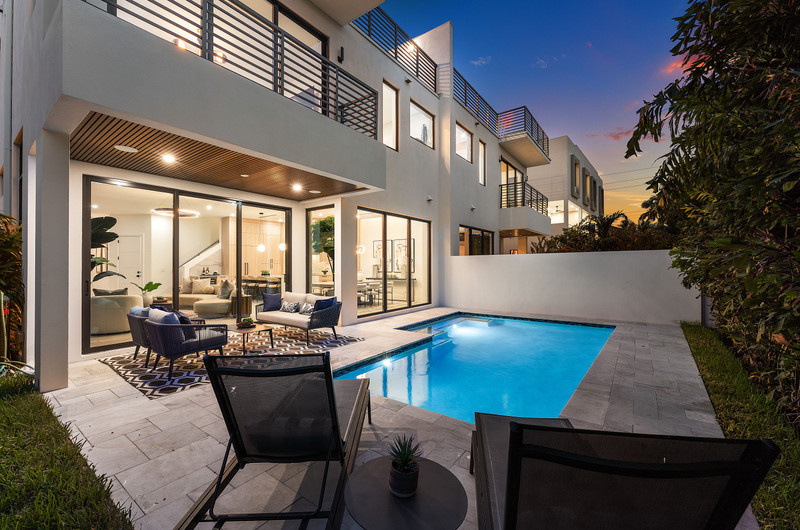The Banyan Boca private pool and contemporary residence at twilight