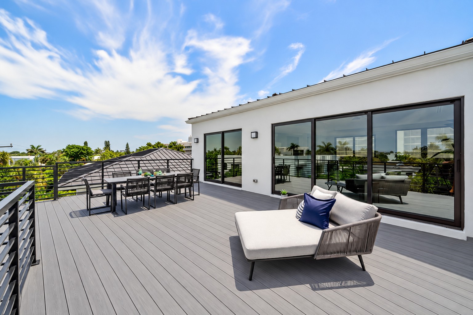 Rooftop terrace with gray decking, outdoor dining and lounge seating