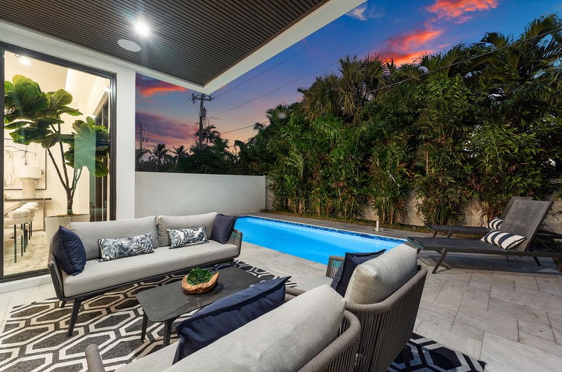 Private pool terrace and lounge at twilight